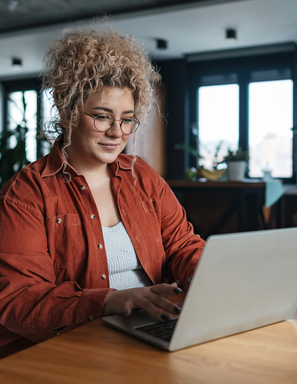 woman sitting in front of computer