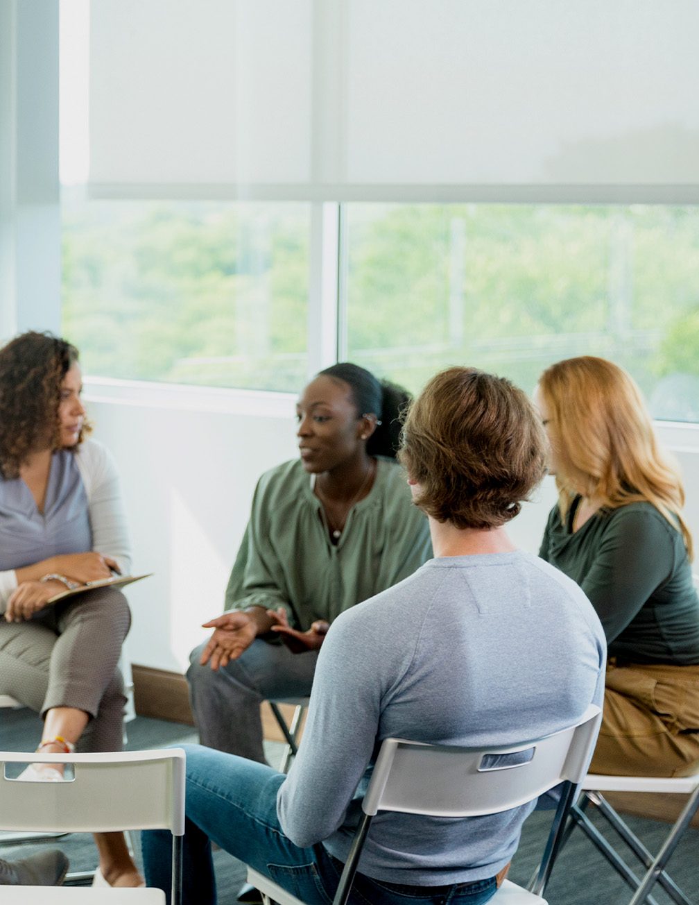 women sitting in circle talking