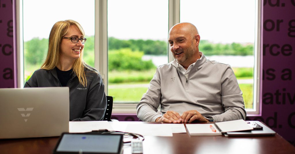Bryan and Robin meeting in Cedar Falls office